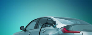 photo of an electric car with a charger plugged in