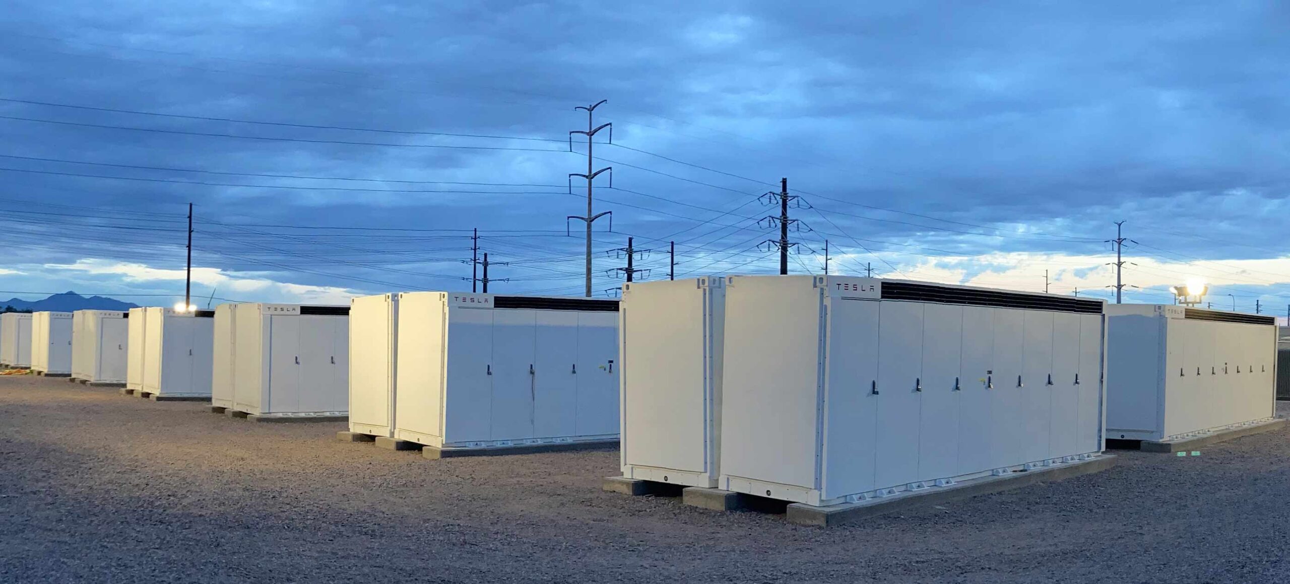 photo of banks of energy storage units with the Tesla logo