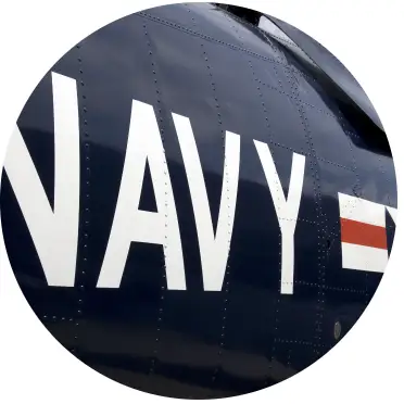 The side of a Navy vehicle, with the Navy logo